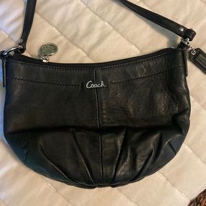 COACH purse black with purple lining. 3 zippers in total. Excellent condition.